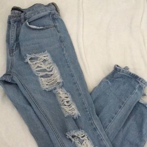 Destroyed light wash denim jeans